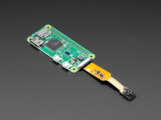 Angled shot of Zero Spy Camera for Raspberry Pi Zero connected to a ribbon cable.