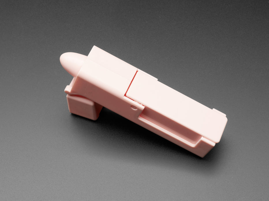 Pink finger pointer shown with compartments open and foam sponge shown inside