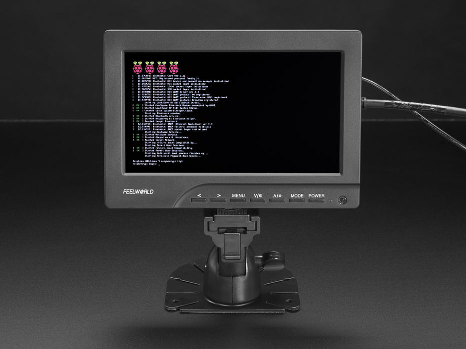 Front view of assembled and powered on HDMI 4 Pi - 7" Display. The monitor displays a desktop background with the Adafruit logo, Raspberry Pi logo, and a pink heart.