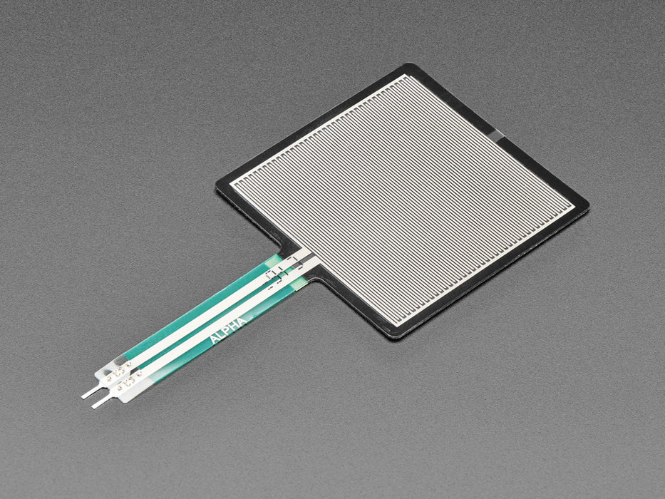 Finger pressing down on square force-sensitive sensor