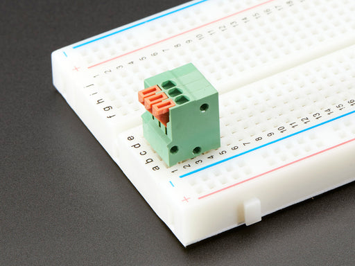 Top view of five Configurable Spring Terminal Blocks - 3 Pin 0.1" Pitch.