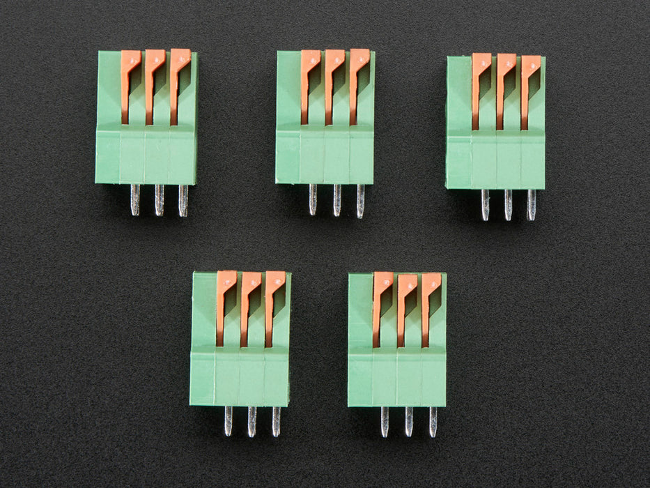 Top view of five Configurable Spring Terminal Blocks - 3 Pin 0.1" Pitch.