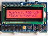 Top down view of a Adafruit RGB Positive 16x2 LCD+Keypad Kit for Raspberry Pi with Purple background. 