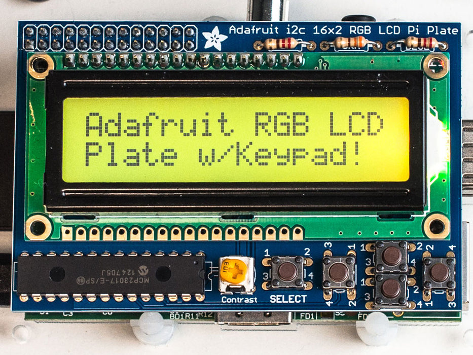 Top down view of a Adafruit RGB Positive 16x2 LCD+Keypad Kit for Raspberry Pi with Purple background. 