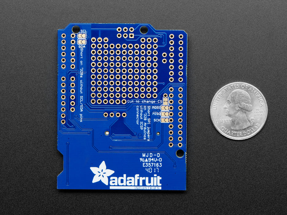 Angled shot of a Adafruit Assembled Data Logging shield connected to an Arduino.