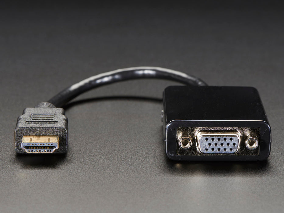 Top down view of a HDMI to VGA Video Adapter and 3.5mm Male/Male Stereo Cable.