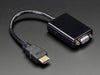 Top down view of a HDMI to VGA Video Adapter and 3.5mm Male/Male Stereo Cable.