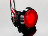 head-on shot of illuminated large red arcade button with LED.