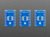 A pair of tweezers holding a SOIC chip hovers over the SMT Breakout PCB for SOIC-20 or TSSOP-20.