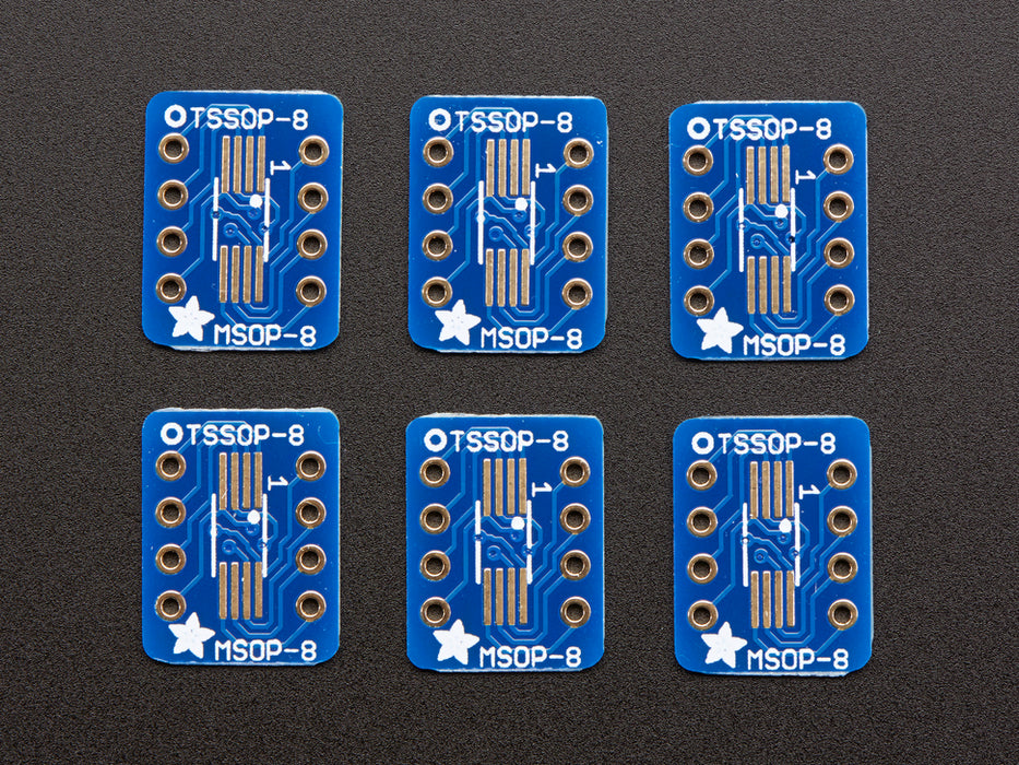 A pair of tweezers holding a microchip hovers over the SMT Breakout PCB for SOIC-8, MSOP-8 or TSSOP-8.