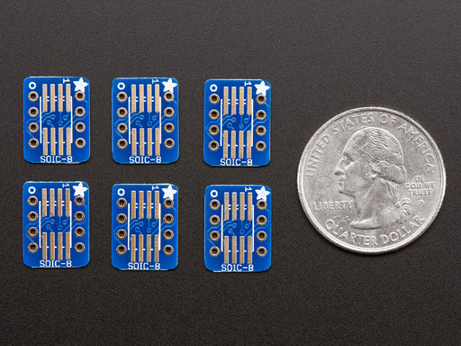 A pair of tweezers holding a microchip hovers over the SMT Breakout PCB for SOIC-8, MSOP-8 or TSSOP-8.