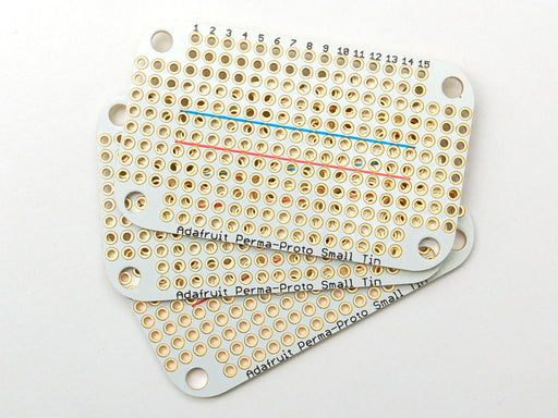 Top view of a small Altoids breath mint case with two Adafruit Perma-Proto Small Mint Tin Size Breadboard PCBs.