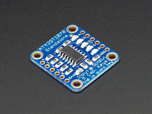 Standalone 5-Pad Capacitive Touch Sensor Breakout on breadboard with hand touching an attached wire