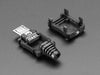Angled shot of an assembled USB DIY Connector Shell with a Type Micro-B Plug. The male plug faces the camera at an angle.