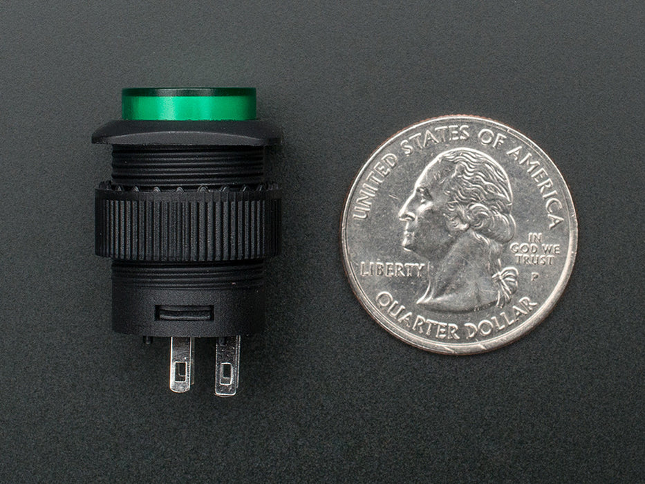 Angled shot of a green 16mm illuminated pushbutton. 