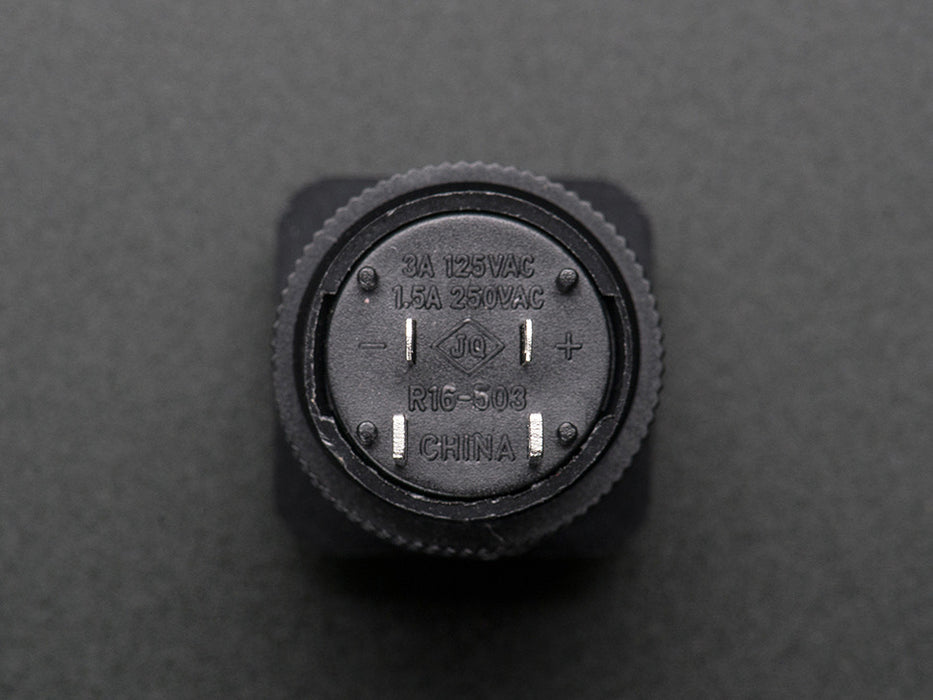 Angled shot of a yellow 16mm illuminated pushbutton. 