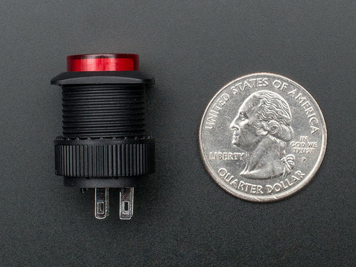 Angled shot of a red 16mm illuminated pushbutton. 