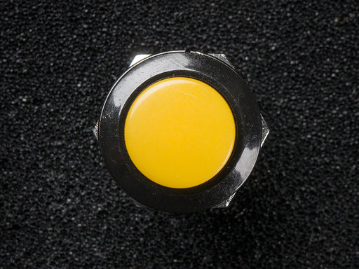 Angled shot of 16mm yellow panel mount pushbutton.