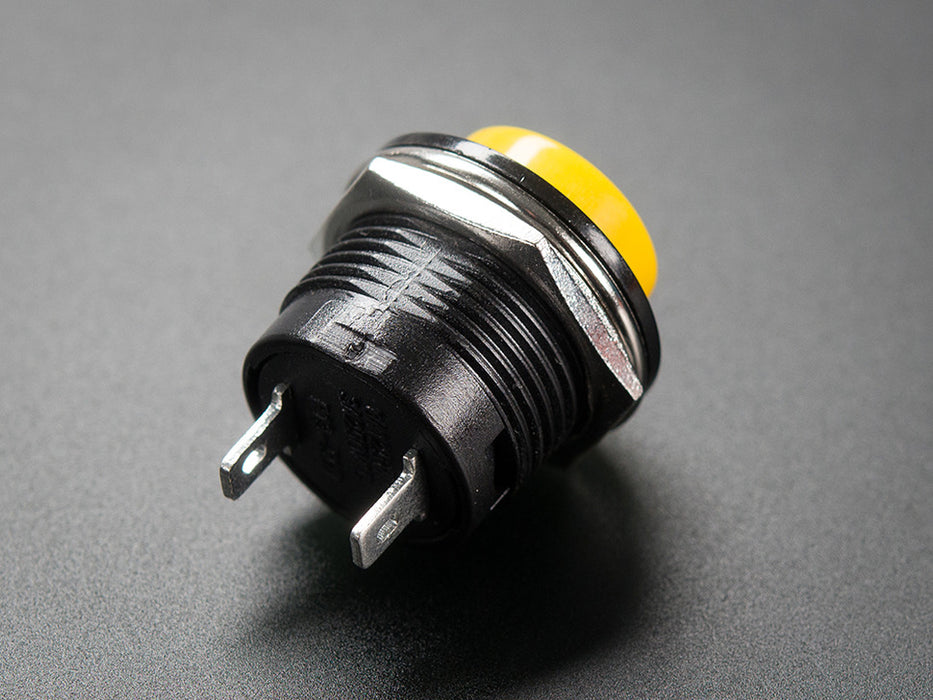 Angled shot of 16mm yellow panel mount pushbutton.