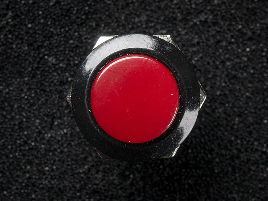 Angled shot of 16mm burgundy panel mount pushbutton.