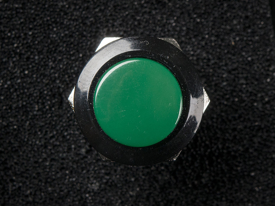 Angled shot of 16mm green panel mount pushbutton.