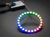 Hand holding NeoPixel Ring with 24 x 5050 RGB LED, lit up rainbow