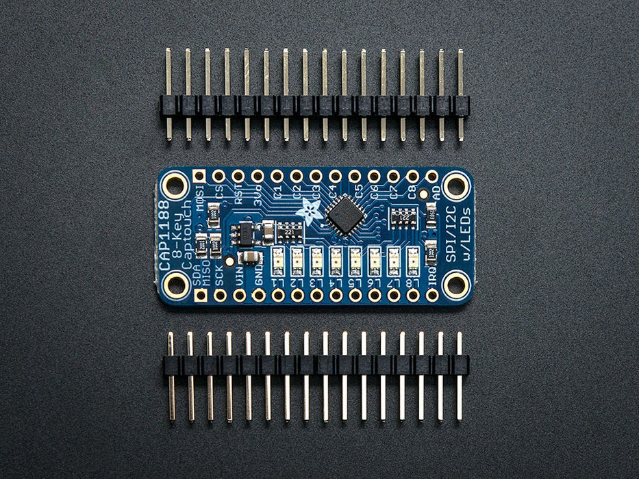 Capacitive Touch Sensor Breakout on breadboard with hand touching many attached wires