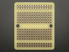 Top view of Adafruit Perma-Proto Quarter-sized Breadboard PCB.