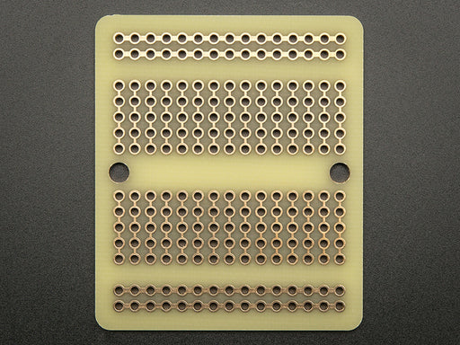 Top view of Adafruit Perma-Proto Quarter-sized Breadboard PCB.