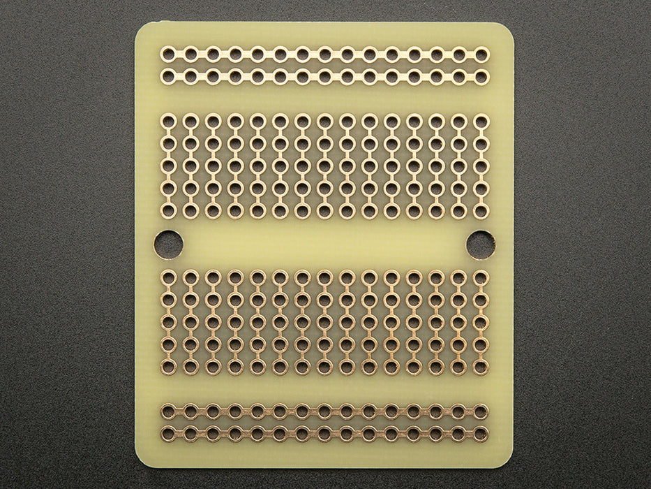 Top view of Adafruit Perma-Proto Quarter-sized Breadboard PCB.