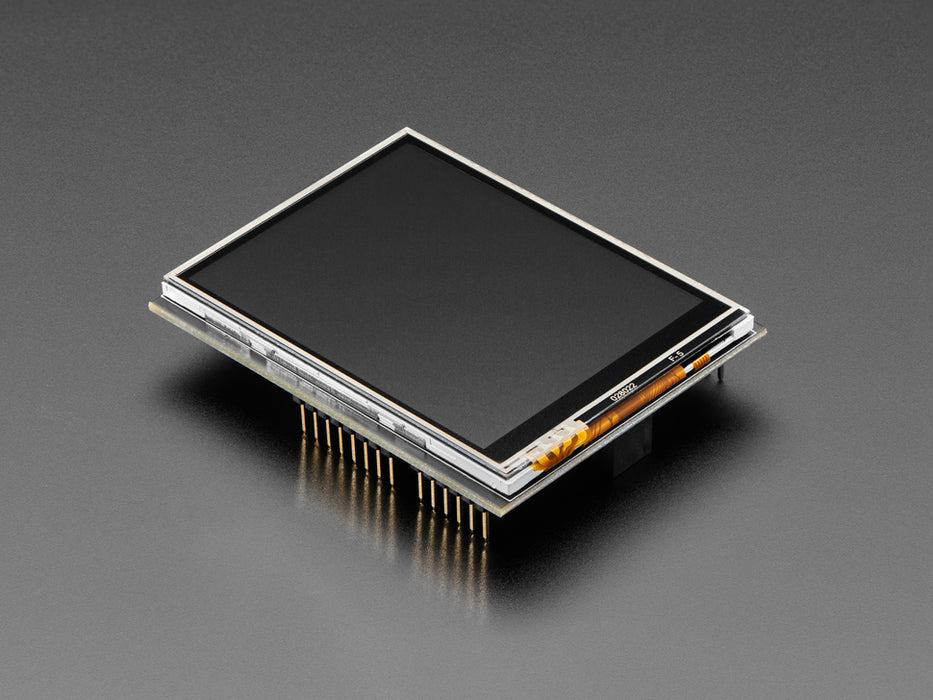 Brown polished fingers holding a 2.8" TFT Touch Shield for Arduino with Resistive Touch Screen with one hand and a finger from the other hand drawing a heart. 