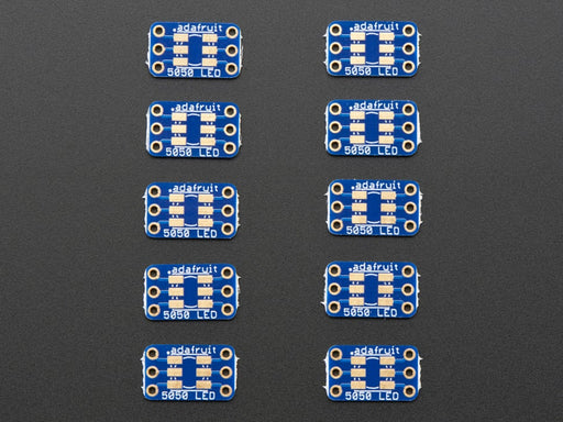 Hand holding 5050 size LED next to breakout board