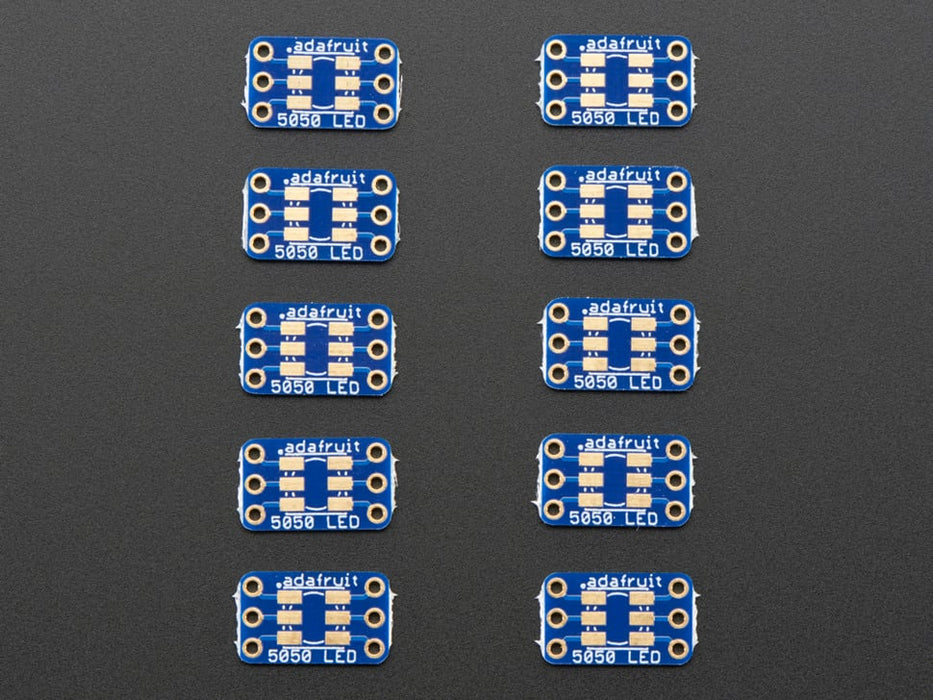 Hand holding 5050 size LED next to breakout board