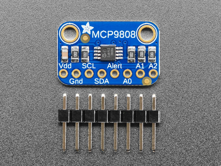 Angled shot of a small, blue, rectangular temperature sensor breakout board.