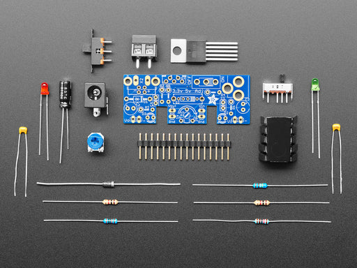 Unassembled kit shot with PCB, various components, chips, resistors, etc.