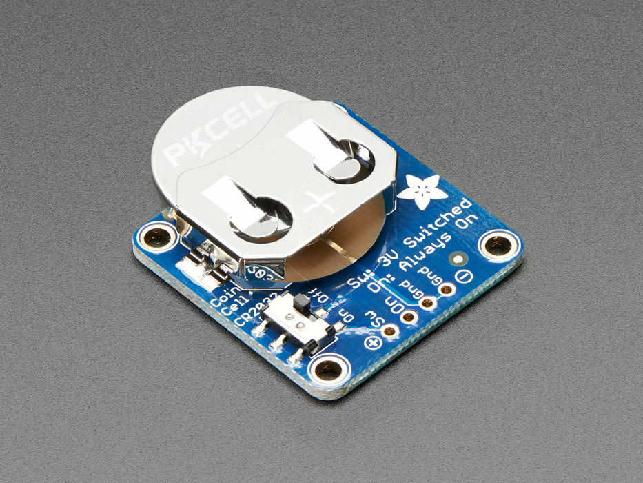 Angled shot of a 20mm Coin Cell Breakout Board w/ On-Off Switch.