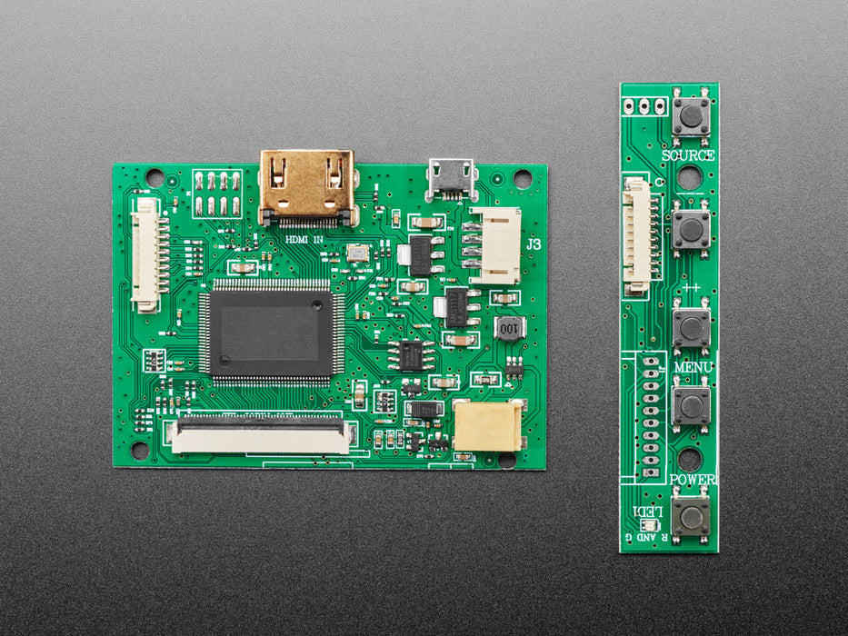 Angled shot of an assembled HDMI 4 Pi: 5" Display (no Touch) w/Mini Driver. The HDMI screen displays a desktop image including the Adafruit logo, the Raspberry Pi logo, and a pink heart.