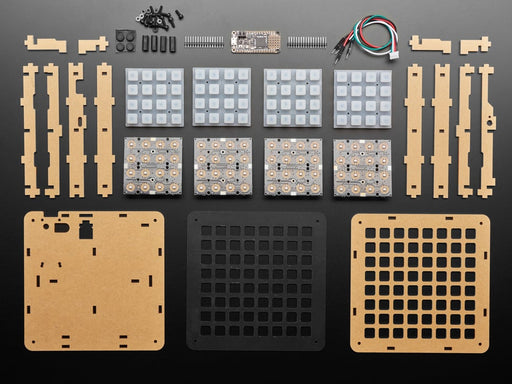 Hand pressing buttons that light up on a Adafruit 8x8 NeoTrellis Feather M4 Kit Pack.