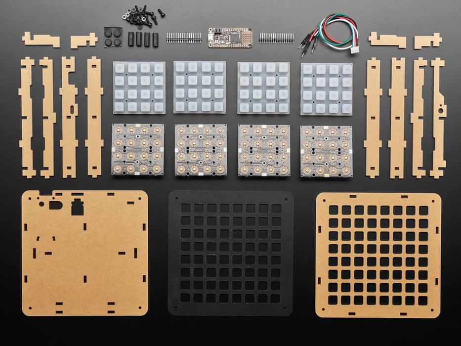 Hand pressing buttons that light up on a Adafruit 8x8 NeoTrellis Feather M4 Kit Pack.