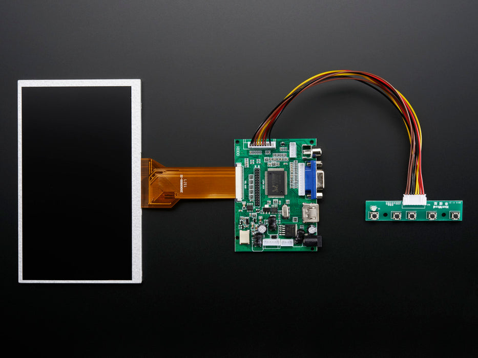 Angled shot of a HDMI 4 Pi: 7" Display no Touchscreen. The monitor displays a desktop background with a adafruit logo, raspberry logo, and a heart. 