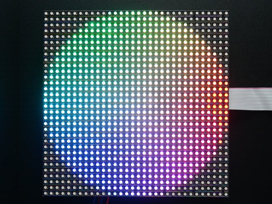 Video of assembled and powered on 32x32 RGB LED Matrix Panel - 5mm pitch. The matrix displays swirling, psychedelic rainbow colors.