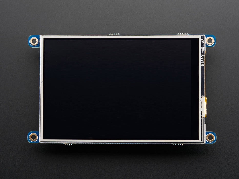 Top down view of a white hand touching the display of a PiTFT - Assembled 480x320 3.5" TFT+Touchscreen for Raspberry Pi.