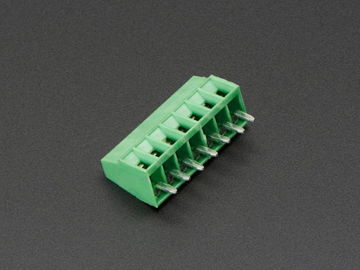 Angled shot of green 7-pin 2.54mm terminal block.