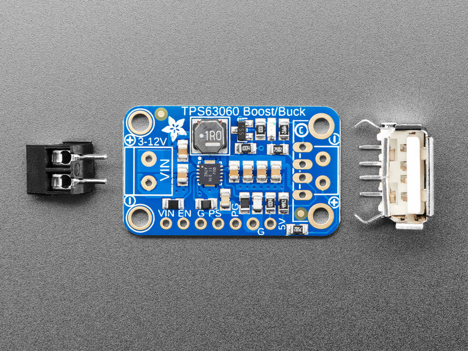 angled shot of blue rectangular buckboost PCB.