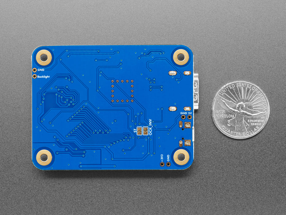 Angled shot of blue, rectangular HDMI breakout board.