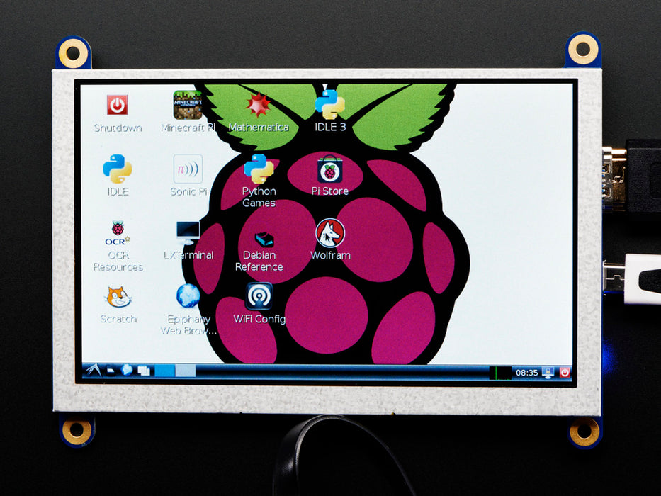 Top down view of a HDMI 5" Display Backpack - Without Touch connected to a Raspberry Pi powered by a USB. The HDMI screen displays a desktop image including the Raspberry Pi logo. 