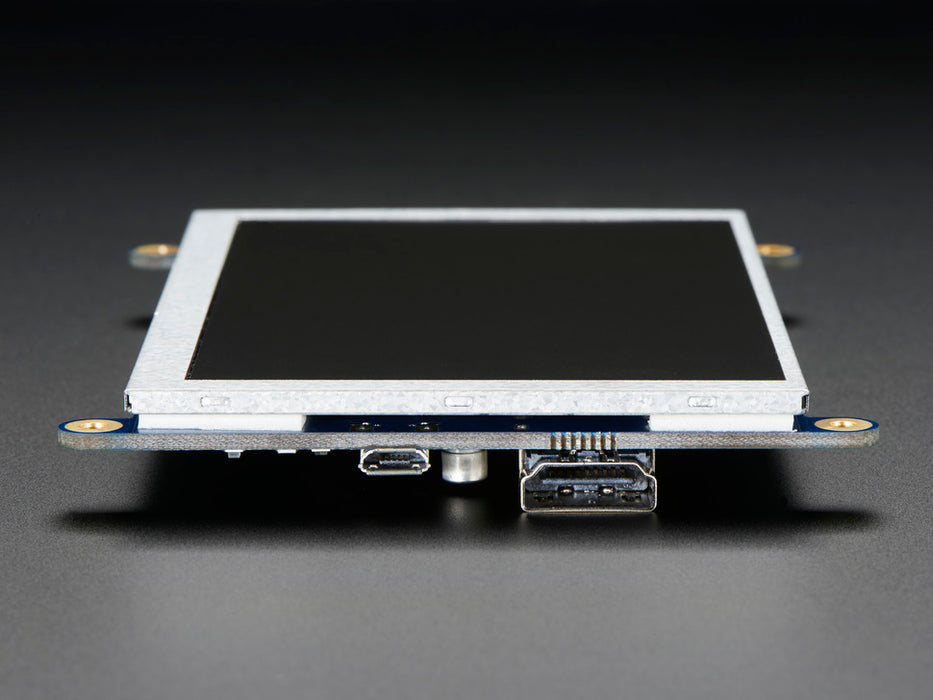 Top down view of a HDMI 5" Display Backpack - Without Touch connected to a Raspberry Pi powered by a USB. The HDMI screen displays a desktop image including the Raspberry Pi logo. 