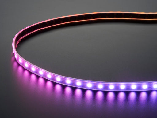 Part of a coiled LED strip glowing purple LEDs.