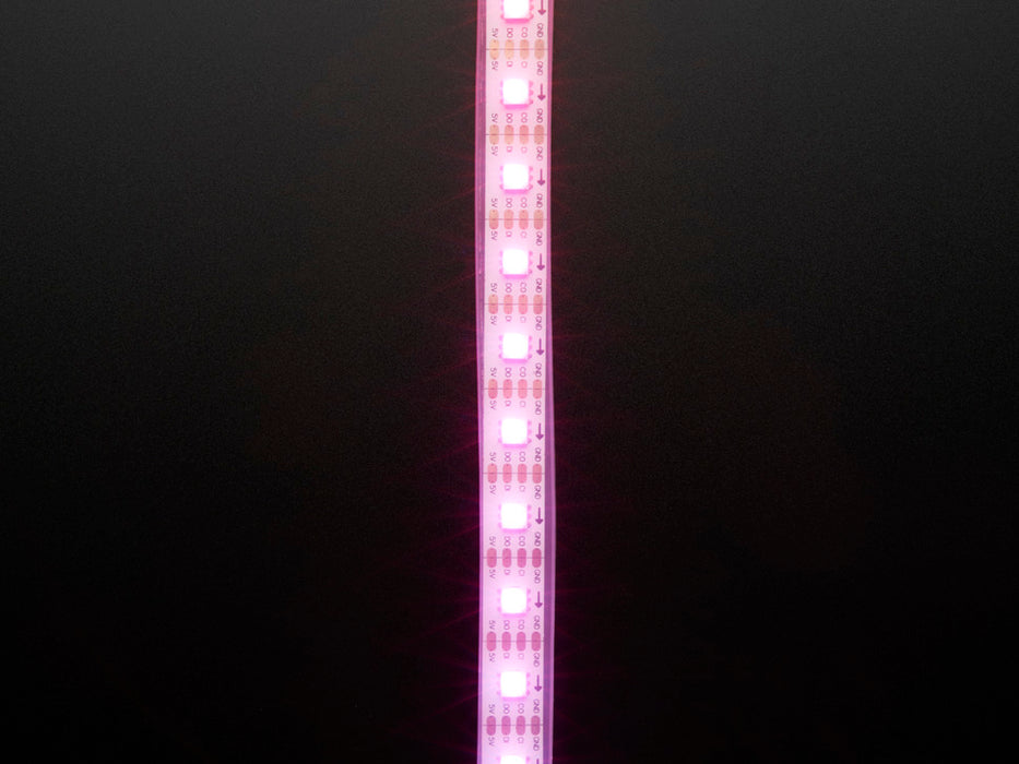 Video of part of a coiled LED strip glowing various colors in succession.