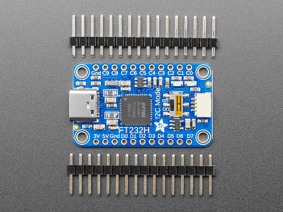 Angled shot of a Adafruit FT232H Breakout - General Purpose USB to GPIO, SPI, I2C - USB C & Stemma QT. 